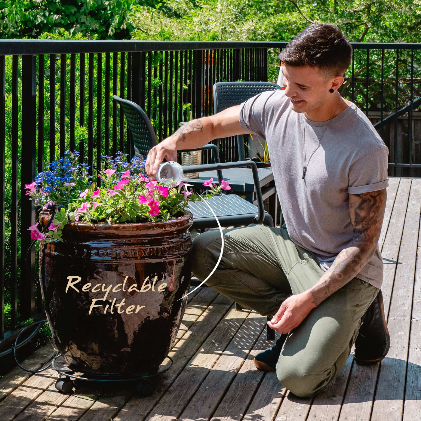 A man opening his recyclable Santevia MINA Alkaline Pitcher filter and composting the minerals#color_black